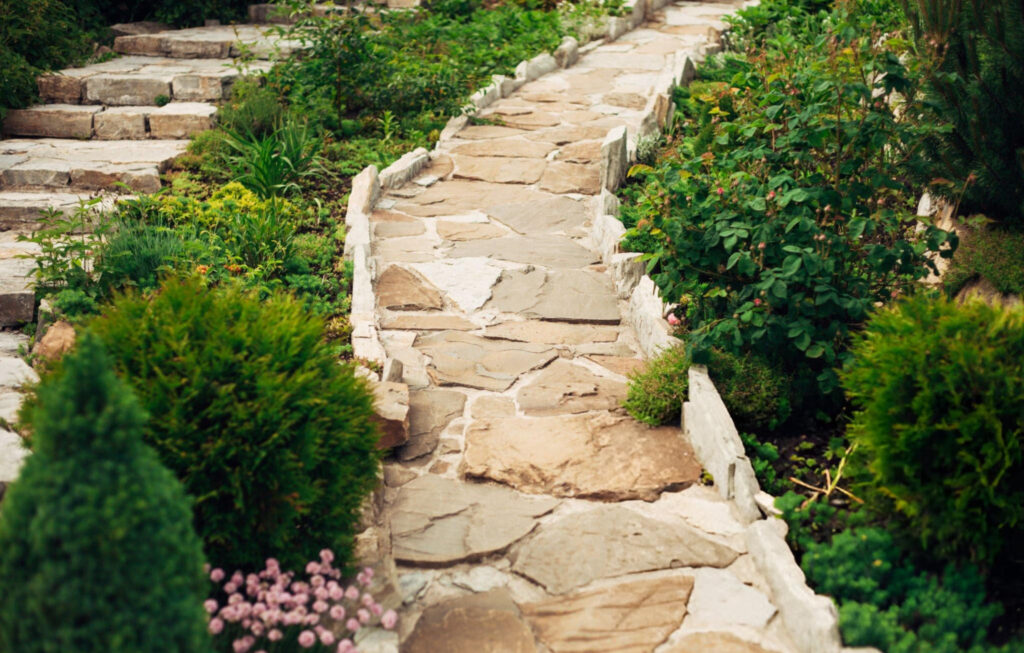 Stone walkway in garden made of big yellow stones