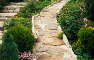 Stone walkway in garden made of big yellow stones